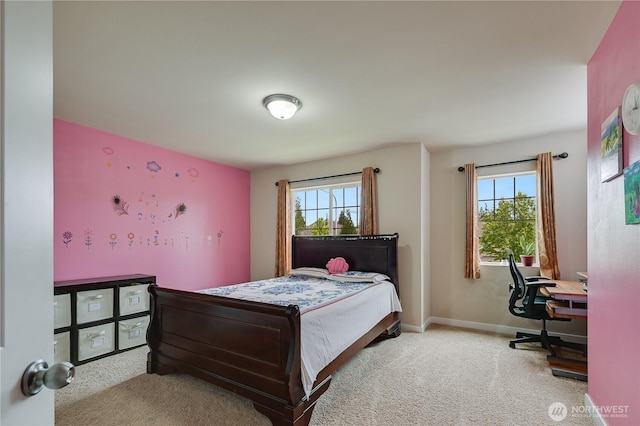 10821 Eastridge Dr NE, Redmond, WA 98053 - carpeted bedroom featuring multiple windows, a desk, and baseboards