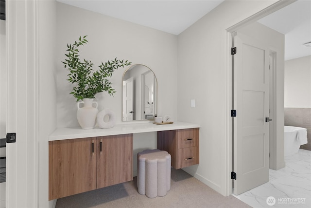5041 Bowen Pl S, Seattle, WA 98118 - full bathroom with vanity, a freestanding bath, and marble look tiles