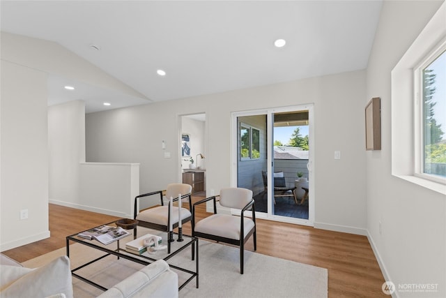 5041 Bowen Pl S, Seattle, WA 98118 - living area featuring lofted ceiling, wood finished floors, baseboards, and recessed lighting