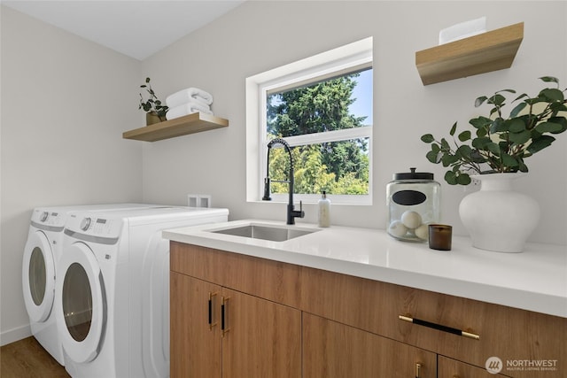 5041 Bowen Pl S, Seattle, WA 98118 - laundry area with washing machine and dryer, cabinet space, and dark wood-style floors