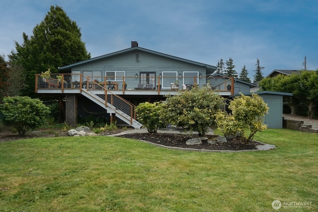 1083 N Vista Del Monte St, Camano Island, WA 98282 - back of property featuring a deck, stairway, and a lawn