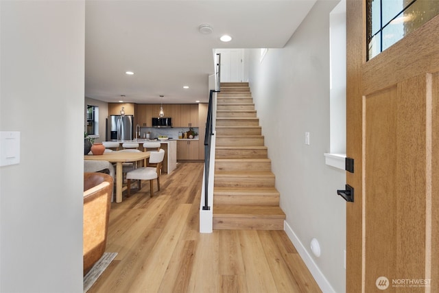 3720 36th Ave SW Unit B, Seattle, WA 98126 - stairs with wood finished floors, recessed lighting, and baseboards