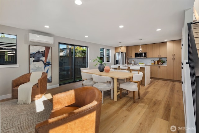 3720 36th Ave SW Unit B, Seattle, WA 98126 - dining room featuring an AC wall unit, light wood-type flooring, recessed lighting, and baseboards
