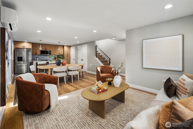 3720 36th Ave SW Unit B, Seattle, WA 98126 - living area with recessed lighting, a wall mounted AC, baseboards, light wood-style flooring, and stairway