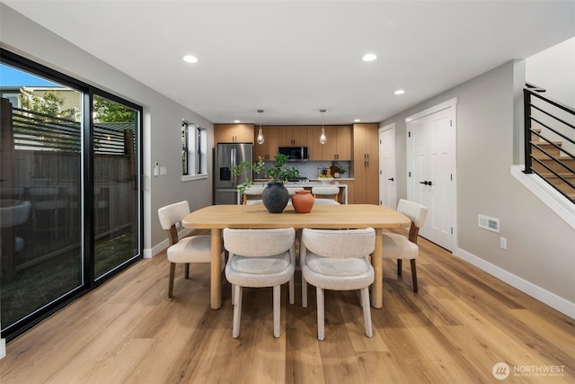 3720 36th Ave SW Unit B, Seattle, WA 98126 - dining area with baseboards, light wood-style floors, recessed lighting, and stairs