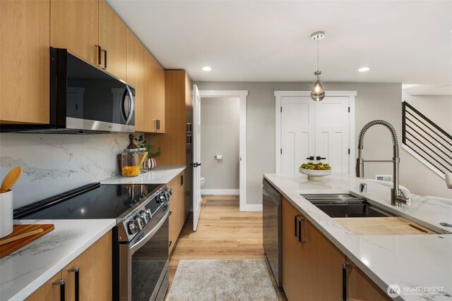 3720 36th Ave SW Unit B, Seattle, WA 98126 - kitchen featuring appliances with stainless steel finishes, recessed lighting, a sink, baseboards, and hanging light fixtures