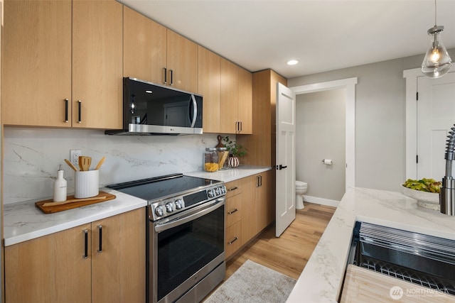 3720 36th Ave SW Unit B, Seattle, WA 98126 - kitchen with stainless steel appliances, light wood-style flooring, backsplash, recessed lighting, and decorative light fixtures