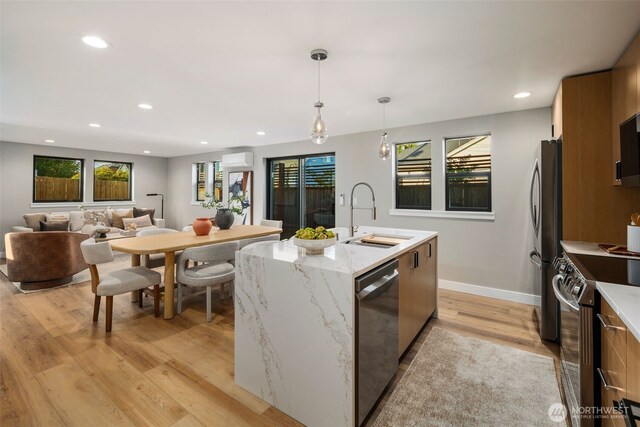 3720 36th Ave SW Unit B, Seattle, WA 98126 - kitchen with appliances with stainless steel finishes, a sink, light wood finished floors, healthy amount of natural light, and recessed lighting