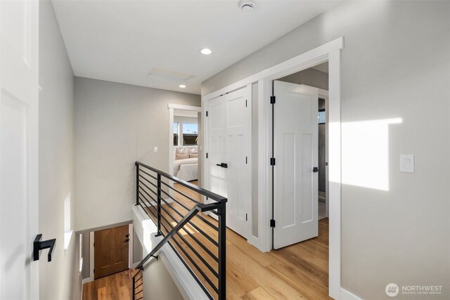 3720 36th Ave SW Unit B, Seattle, WA 98126 - hallway with an upstairs landing, light wood-style flooring, attic access, and recessed lighting