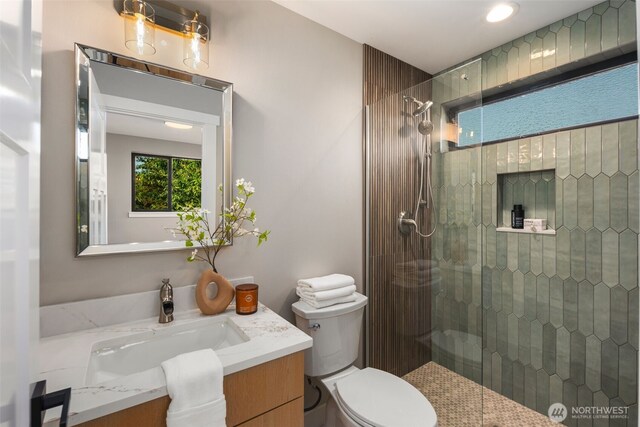 3720 36th Ave SW Unit B, Seattle, WA 98126 - bathroom featuring vanity, a tile shower, and toilet