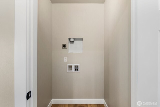 3720 36th Ave SW Unit B, Seattle, WA 98126 - laundry area featuring electric dryer hookup, hookup for a washing machine, baseboards, and wood finished floors