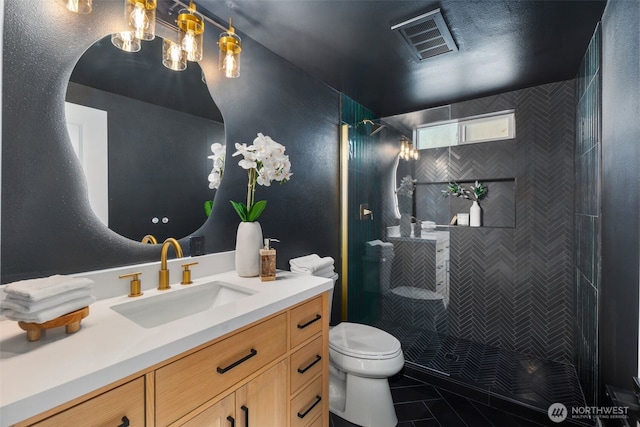 3722 36th Ave SW, Seattle, WA 98126 - bathroom with vanity, toilet, tiled shower, and tile patterned flooring