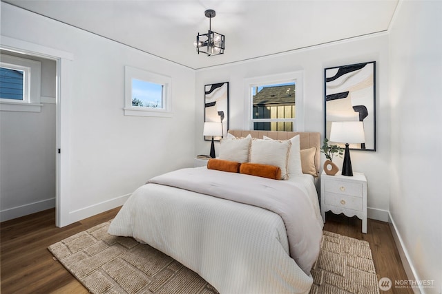 3722 36th Ave SW, Seattle, WA 98126 - bedroom with wood finished floors, baseboards, and multiple windows