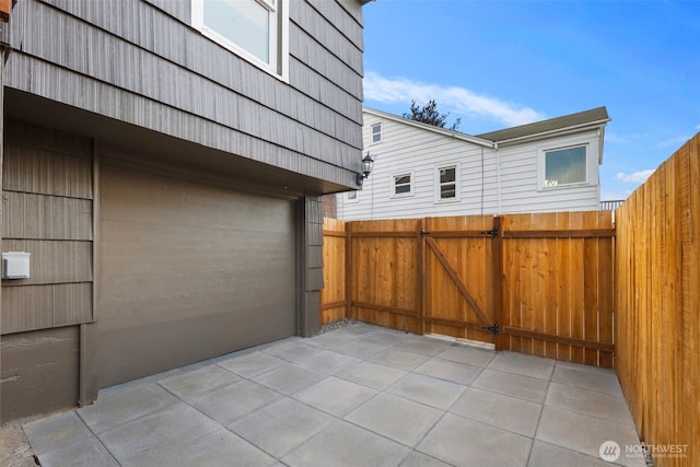3722 36th Ave SW, Seattle, WA 98126 - view of patio with a gate and a garage
