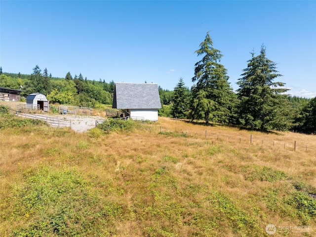 424 Maranatha, Kelso, WA 98626 - view of yard featuring an outdoor structure and a view of rural / pastoral area