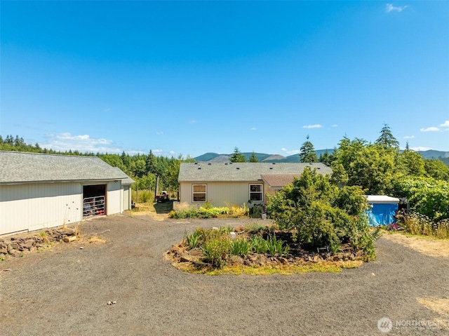 424 Maranatha, Kelso, WA 98626 - view of property exterior with a detached garage, an outdoor structure, and an outbuilding