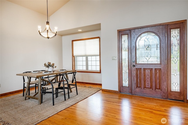 8022 Makah Rd, Blaine, WA 98230 - foyer with a chandelier, baseboards, wood finished floors, and high vaulted ceiling