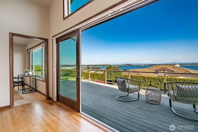 8022 Makah Rd, Blaine, WA 98230 - entryway featuring a water view, light wood-style flooring, and baseboards