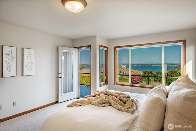 8022 Makah Rd, Blaine, WA 98230 - bedroom with carpet flooring, access to outside, baseboards, and a water view