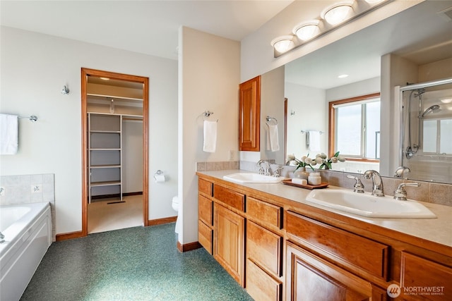 8022 Makah Rd, Blaine, WA 98230 - bathroom with a shower stall, double vanity, a garden tub, a walk in closet, and toilet