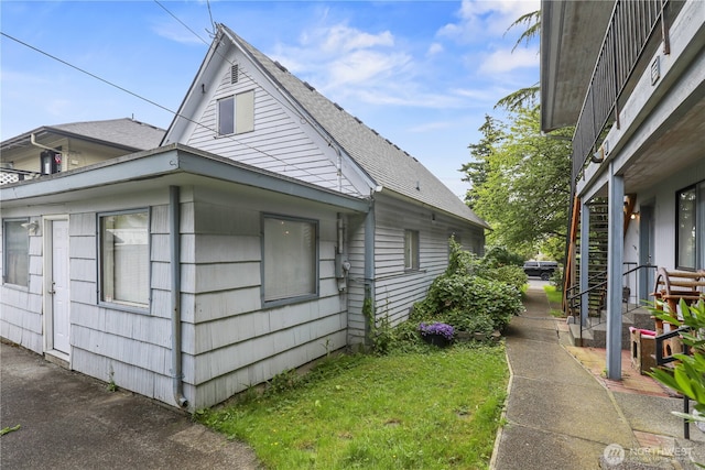 3718 Wetmore Ave, Everett, WA 98201 - view of side of property with roof with shingles and a lawn