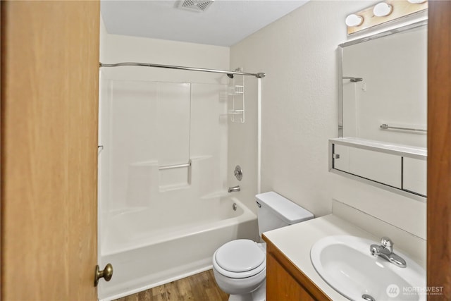 3718 Wetmore Ave, Everett, WA 98201 - full bathroom with vanity, toilet,  shower combination, and wood finished floors