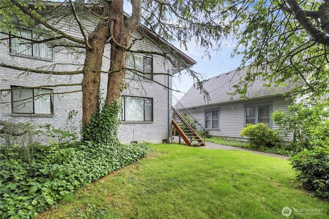 3718 Wetmore Ave, Everett, WA 98201 - back of house with stairs, a yard, and brick siding