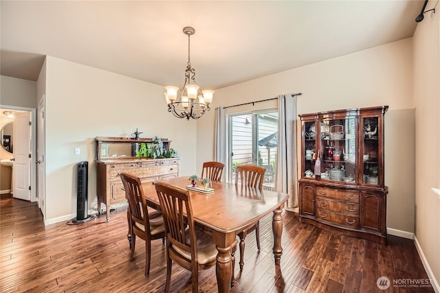 4306 Maple St SE, Olympia, WA 98501 - dining area with dark wood-style flooring and a chandelier