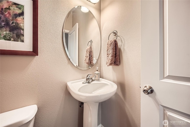 4306 Maple St SE, Olympia, WA 98501 - bathroom featuring toilet and a textured wall