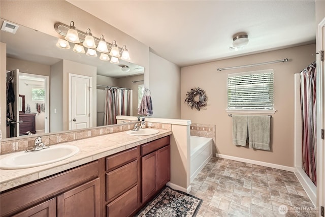4306 Maple St SE, Olympia, WA 98501 - bathroom with a garden tub, healthy amount of natural light, double vanity, and curtained shower
