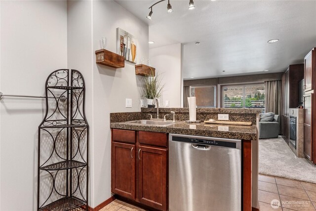 322 W Woodin Ave Unit 620, Chelan, WA 98816 - kitchen featuring stainless steel dishwasher, tile counters, light tile patterned flooring, a sink, and a peninsula