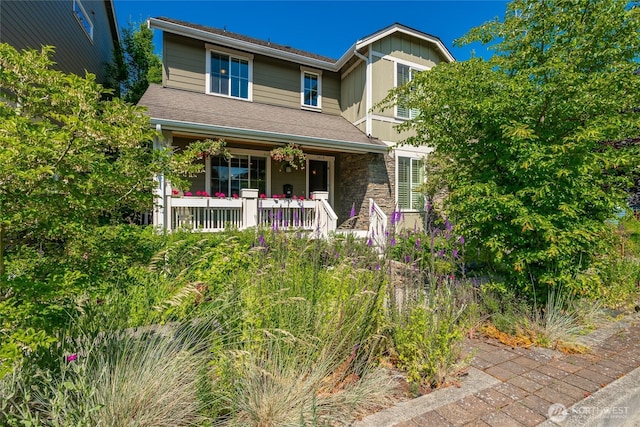 2413 Peabody St, Bellingham, WA 98225 - view of front of property with a porch, stone siding, and board and batten siding