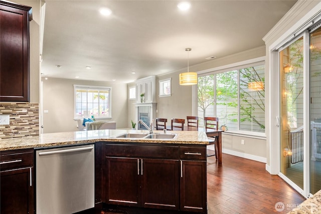2413 Peabody St, Bellingham, WA 98225 - kitchen featuring dishwasher, a sink, dark wood-style flooring, a glass covered fireplace, and backsplash