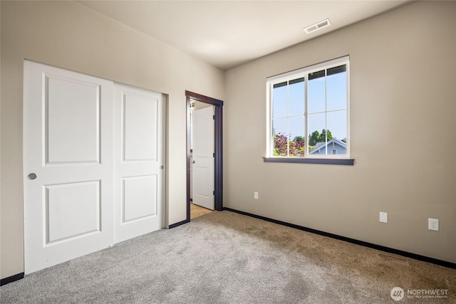 2413 Peabody St, Bellingham, WA 98225 - unfurnished bedroom featuring carpet floors, baseboards, and a closet