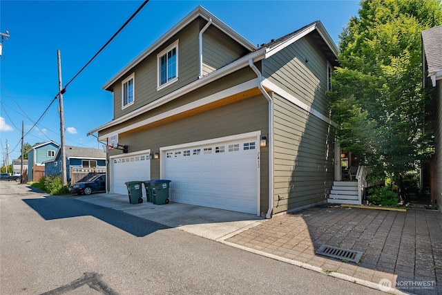 2413 Peabody St, Bellingham, WA 98225 - view of side of home with an attached garage and driveway