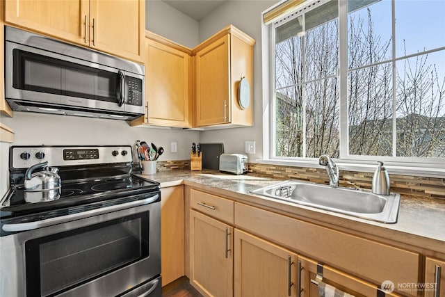 2413 Peabody St, Bellingham, WA 98225 - kitchen featuring appliances with stainless steel finishes, a sink, light brown cabinetry, and light countertops
