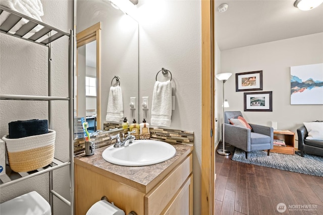 2413 Peabody St, Bellingham, WA 98225 - bathroom featuring vanity, wood finished floors, and a textured wall