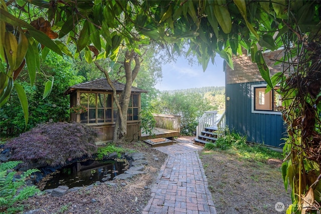 19709 Whiteman Cove Rd SW, Longbranch, WA 98351 - view of yard with a gazebo and a wooden deck