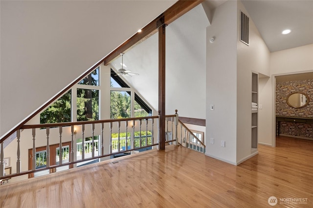 19709 Whiteman Cove Rd SW, Longbranch, WA 98351 - bonus room featuring high vaulted ceiling, ceiling fan, wood finished floors, and built in features