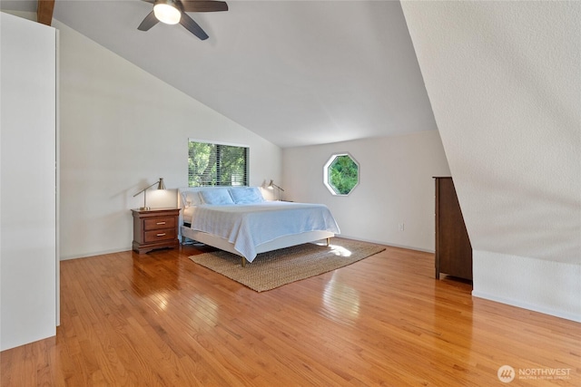 19709 Whiteman Cove Rd SW, Longbranch, WA 98351 - bedroom featuring vaulted ceiling, light wood-style floors, and ceiling fan