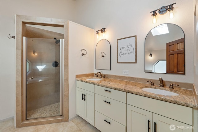 19709 Whiteman Cove Rd SW, Longbranch, WA 98351 - full bath featuring double vanity, a stall shower, and tile patterned flooring