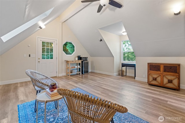 19709 Whiteman Cove Rd SW, Longbranch, WA 98351 - sitting room with a skylight, wood finished floors, lofted ceiling, and ceiling fan