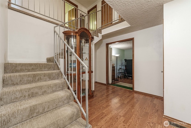 29139 NE Hammond Ct, Battle Ground, WA 98604 - stairway featuring wood finished floors and baseboards