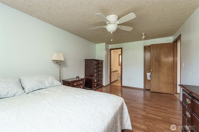 29139 NE Hammond Ct, Battle Ground, WA 98604 - bedroom featuring wood finished floors, a textured ceiling, connected bathroom, and ceiling fan