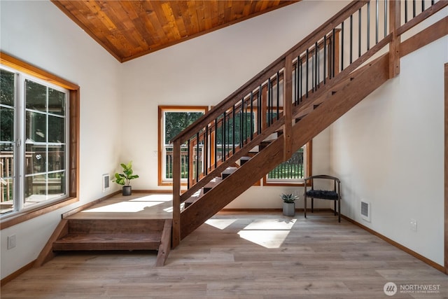 435 Thumper Ln, Camano Island, WA 98282 - stairs featuring healthy amount of natural light, baseboards, wood finished floors, and wooden ceiling