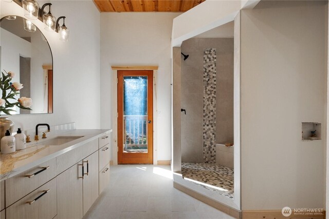 435 Thumper Ln, Camano Island, WA 98282 - full bath featuring vanity, tiled shower, wood ceiling, and tile patterned floors