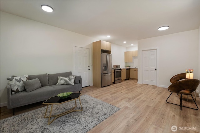 435 Thumper Ln, Camano Island, WA 98282 - living room featuring light wood-style flooring, recessed lighting, and baseboards