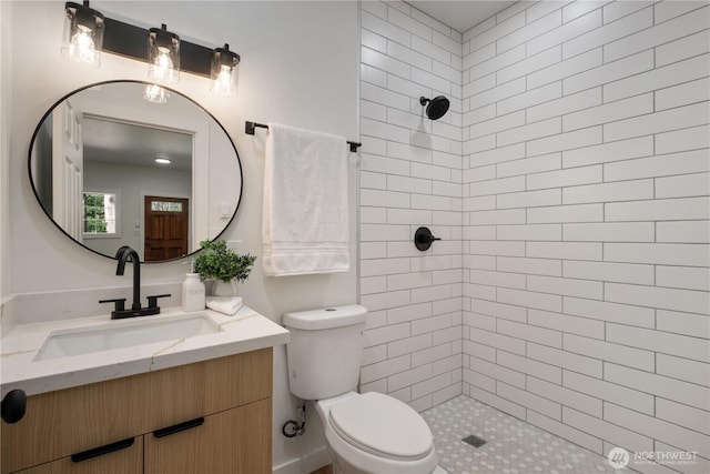 435 Thumper Ln, Camano Island, WA 98282 - bathroom featuring vanity, a tile shower, and toilet