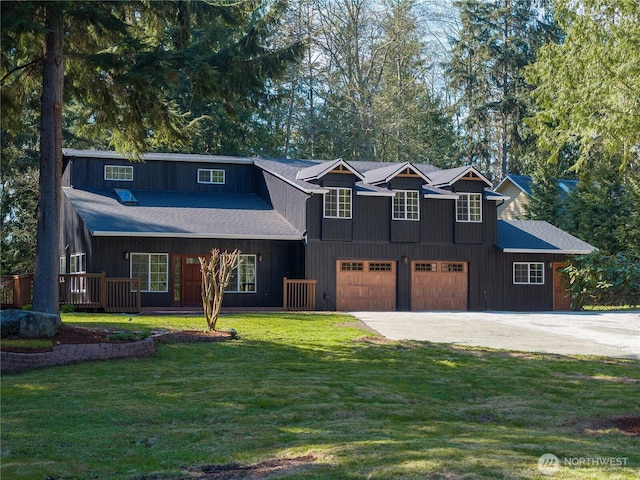 435 Thumper Ln, Camano Island, WA 98282 - view of front of property featuring concrete driveway, a front lawn, and a garage