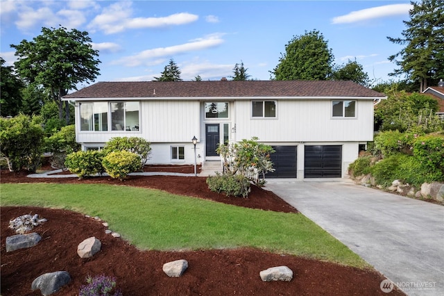 28830 11th Ave S, Federal Way, WA 98003 - bi-level home featuring driveway, a garage, and a front lawn